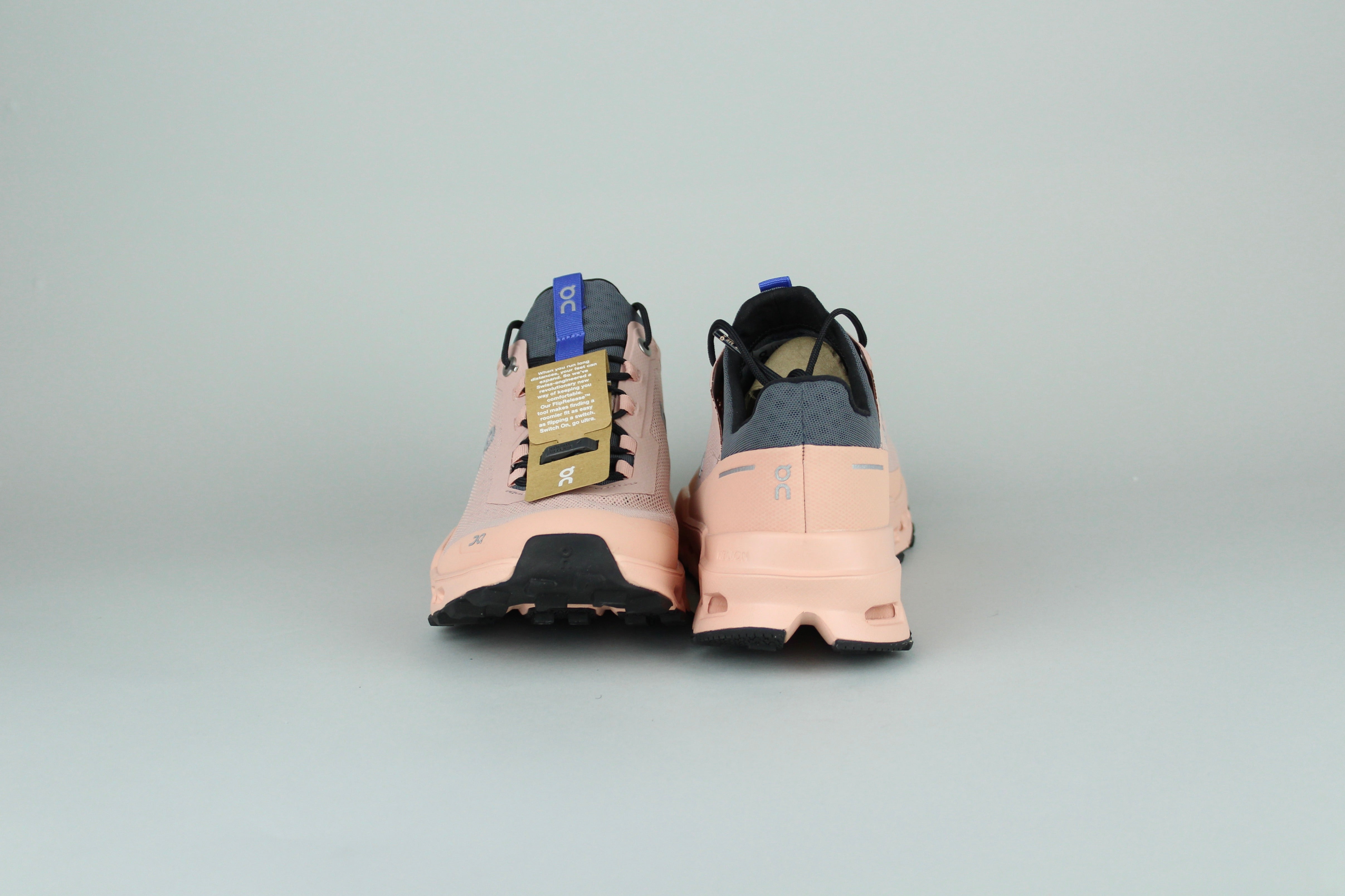 On Cloudultra 1 Rose women's running shoes side view, pink and white color scheme, cushioned and supportive, high-performance athletic footwear, stylish and comfortable