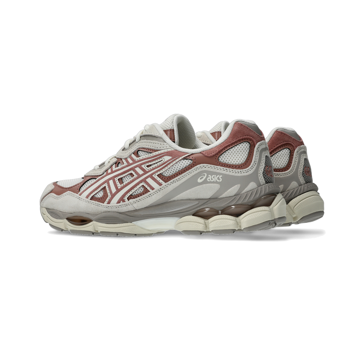 Side view of a cream and brown Asics GEL-NYC sneaker with mesh panels, suede overlays, and a chunky translucent gel midsole, with a second shoe visible behind it.