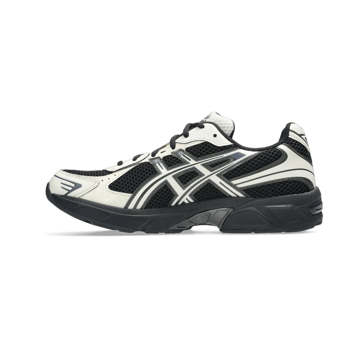 Side view of a black and white Asics Gel-1130 running shoe with mesh panels and a black outsole.