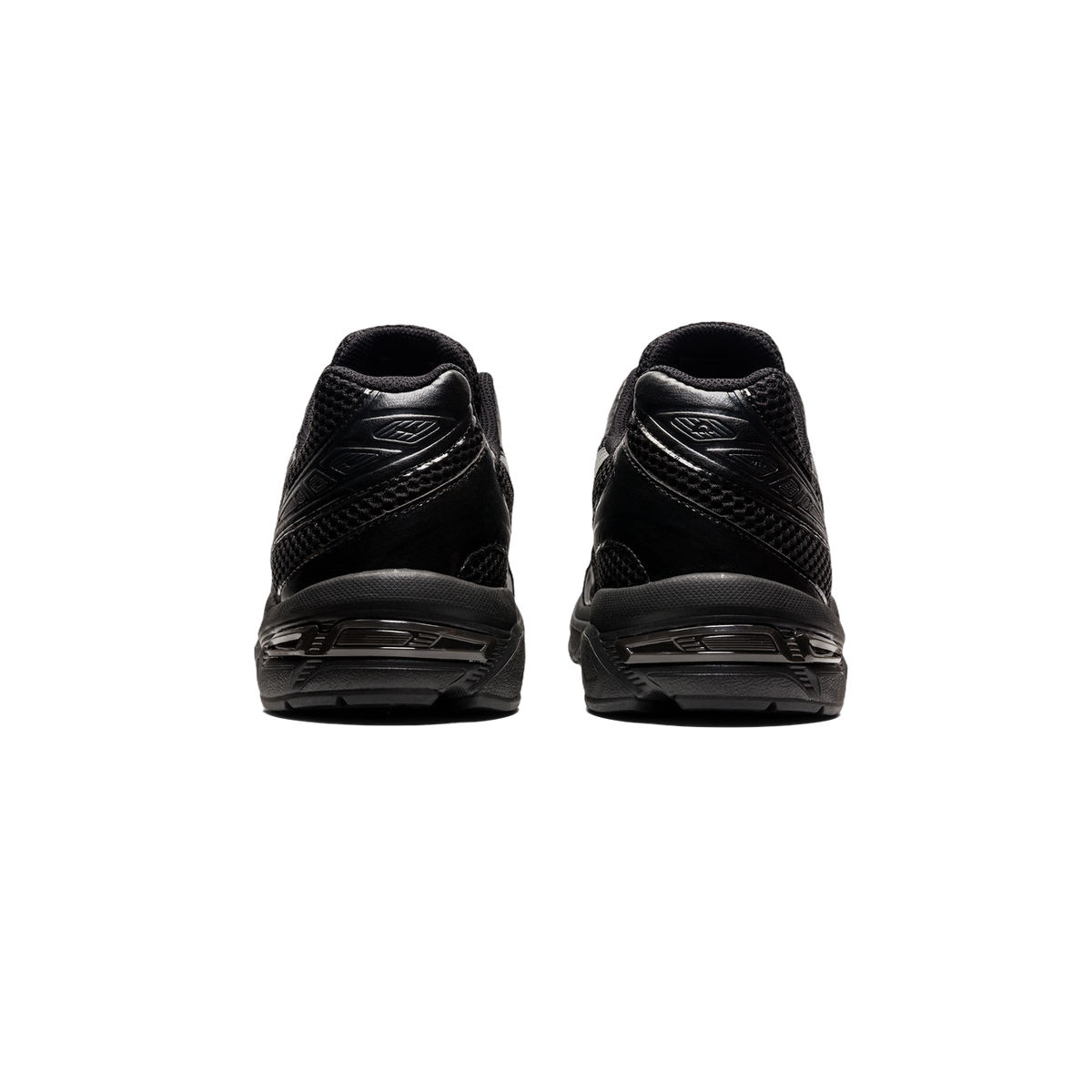 Rear view of a pair of black Asics Gel-1130 sneakers showing the heel counters, gel cushioning unit, and mesh and leather paneling.