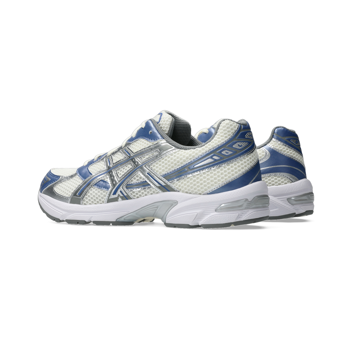 Side view of a pair of Asics Gel-1130 sneakers in white mesh with blue and silver overlays and a white midsole