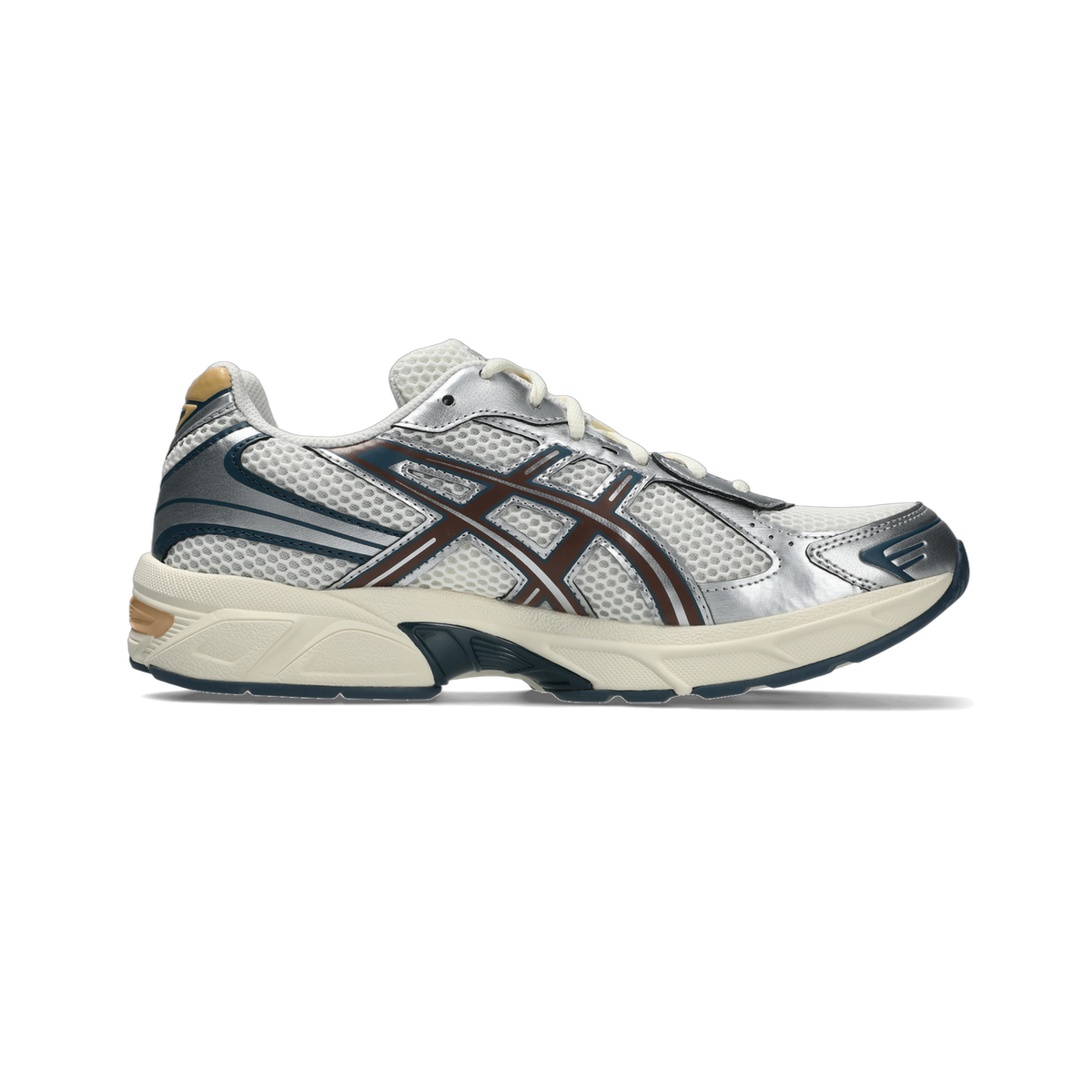 Side view of an Asics Gel-1130 sneaker with toe pointing left, featuring a mesh upper, silver overlays, brown stripes, navy accents, and a cream midsole.