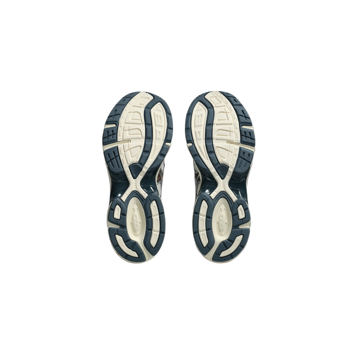 Bottom view of a pair of Asics Gel-1130 sneakers showing navy and cream tread patterned outsoles with GEL branding at the heel