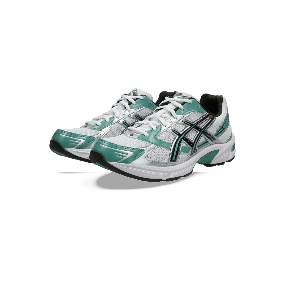 Pair of white Asics Gel-1130 running shoes with green accents and black lace loops, angled toward the left