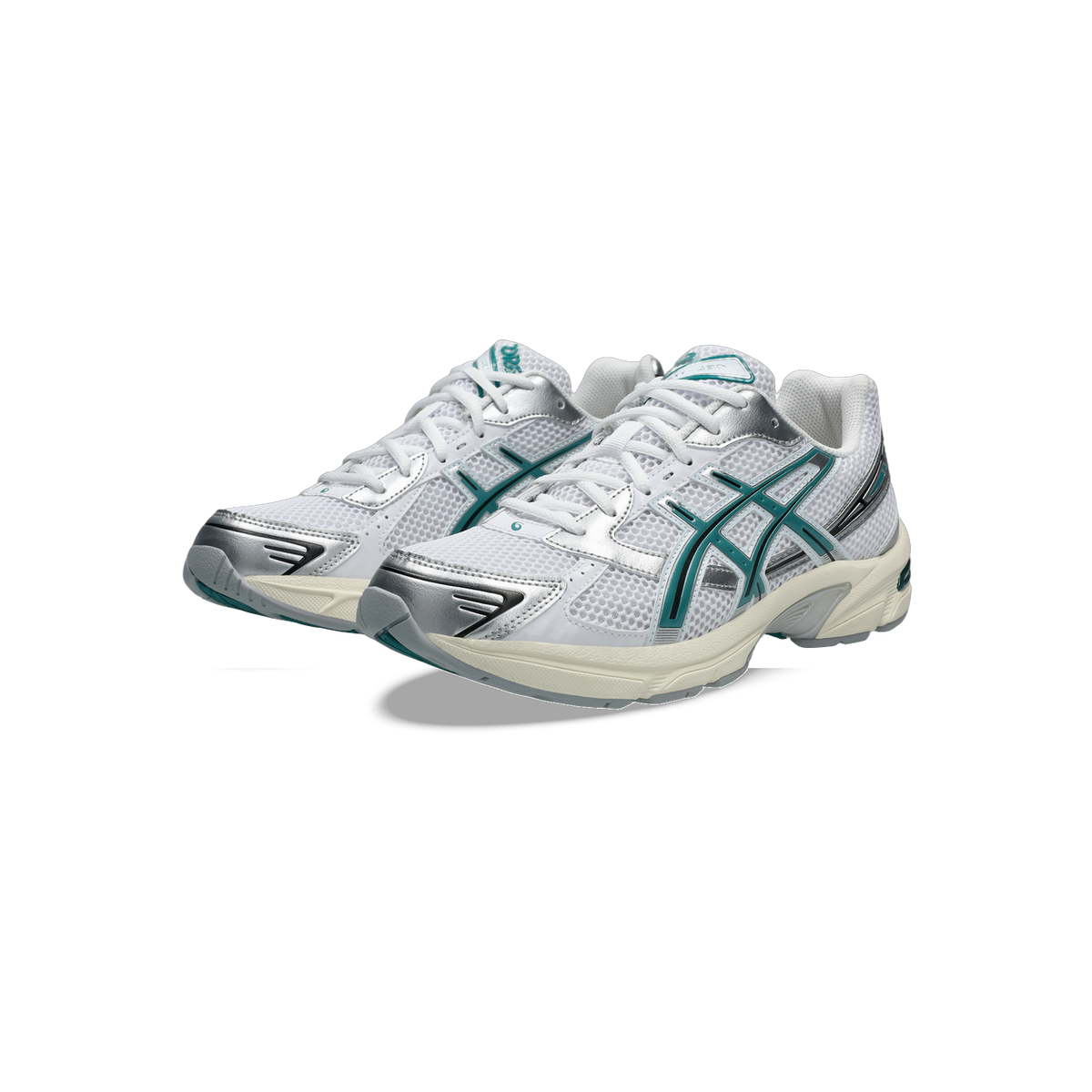 Pair of white Asics Gel-1130 sneakers with teal and silver overlays and a cream midsole, shown at an angle.