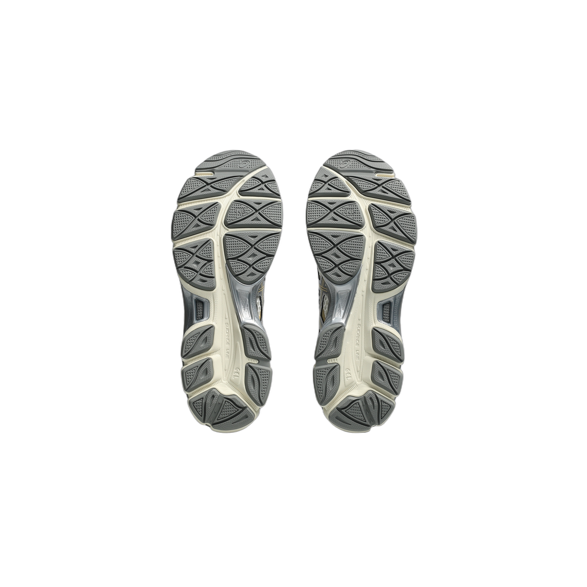 Bottom view of a pair of Asics Gel-Cumulus 16 sneakers showing the grey and cream tread pattern on both outsoles