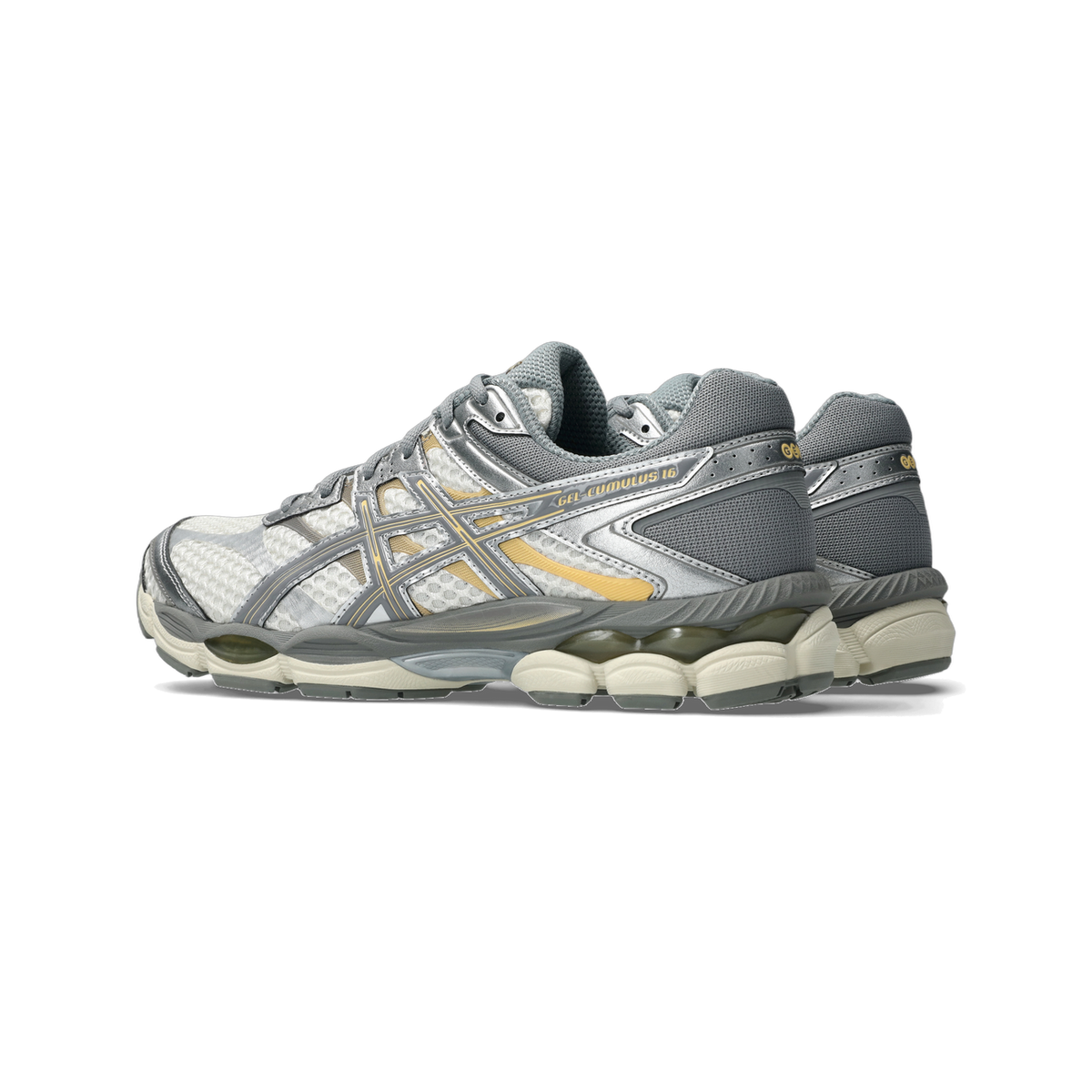 Side view of a pair of Asics Gel-Cumulus 16 running shoes in cream, grey and gold with chunky cream outsole, angled toward the left.