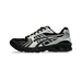 Lateral view of a black and cream Asics Gel-Kayano 14 sneaker with mesh upper, layered overlays, and chunky black midsole.