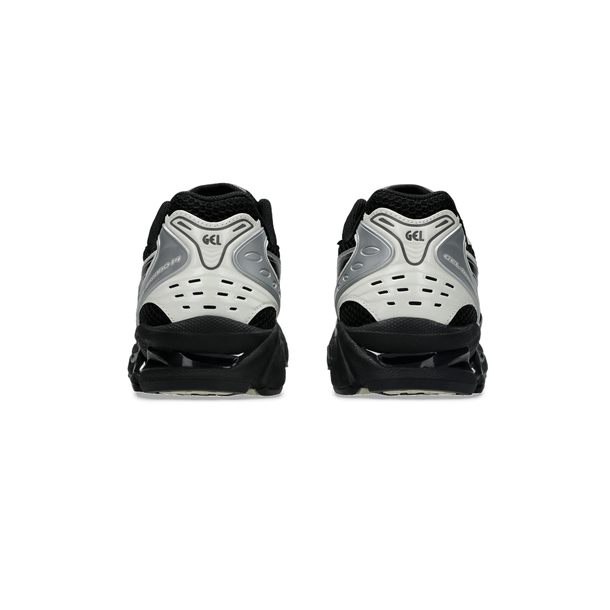 Rear view of a pair of black and cream Asics Gel-Kayano 14 sneakers showing the heel cushioning with GEL branding.