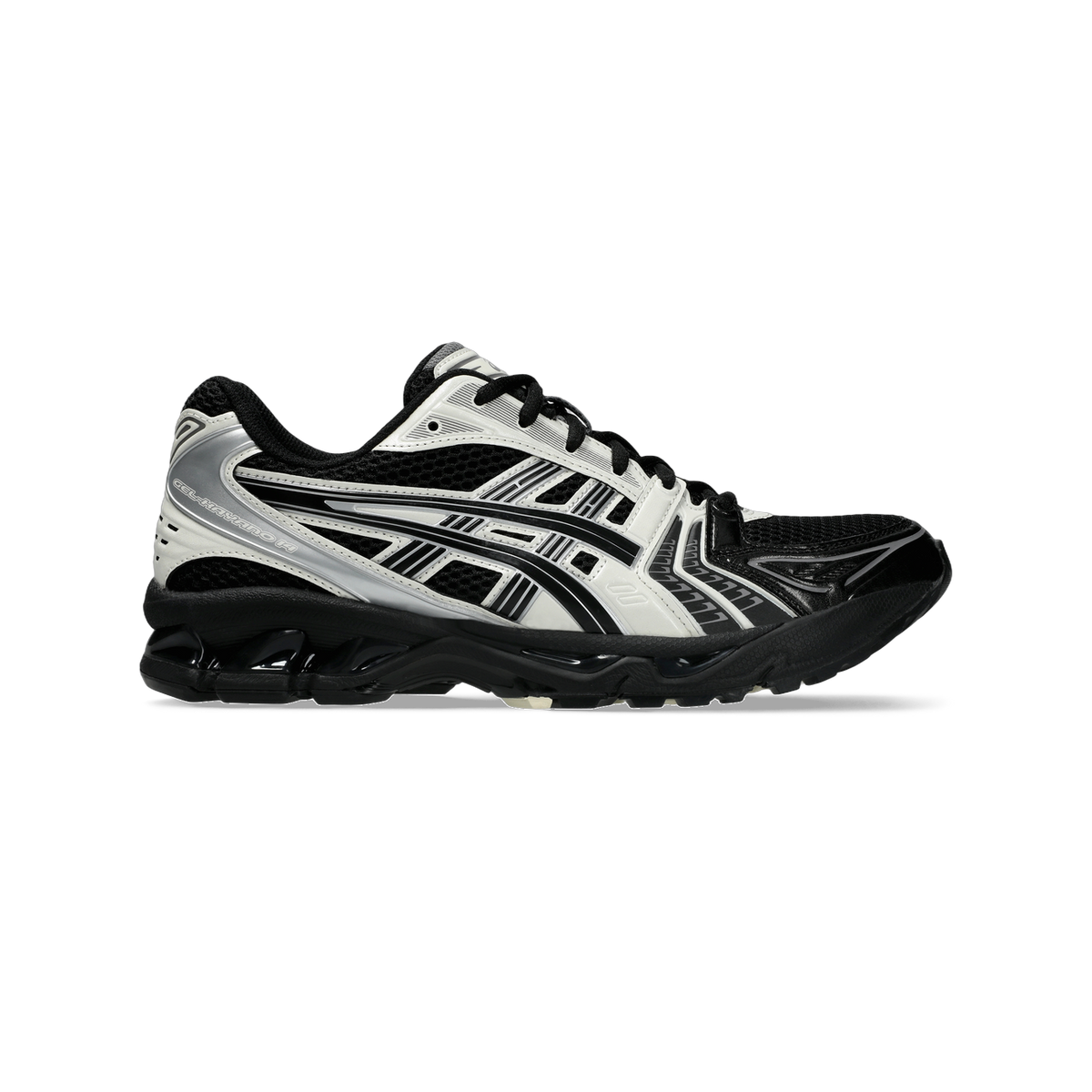 Side view of a black and cream Asics Gel-Kayano 14 sneaker with silver accents and a chunky black outsole.