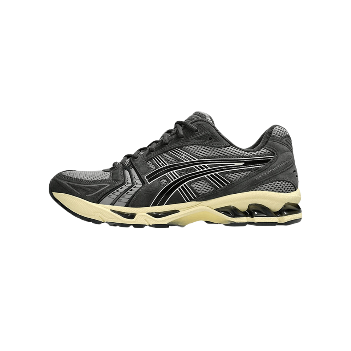 Left Asics Gel-Kayano 14 sneaker in dark grey mesh and suede with black stripe overlays and a cream midsole, shown from the outside with toe pointing left