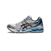 Side view of a white and silver Asics Gel-Kayano 14 running shoe with black overlays and a blue visible gel heel unit, toe pointing left