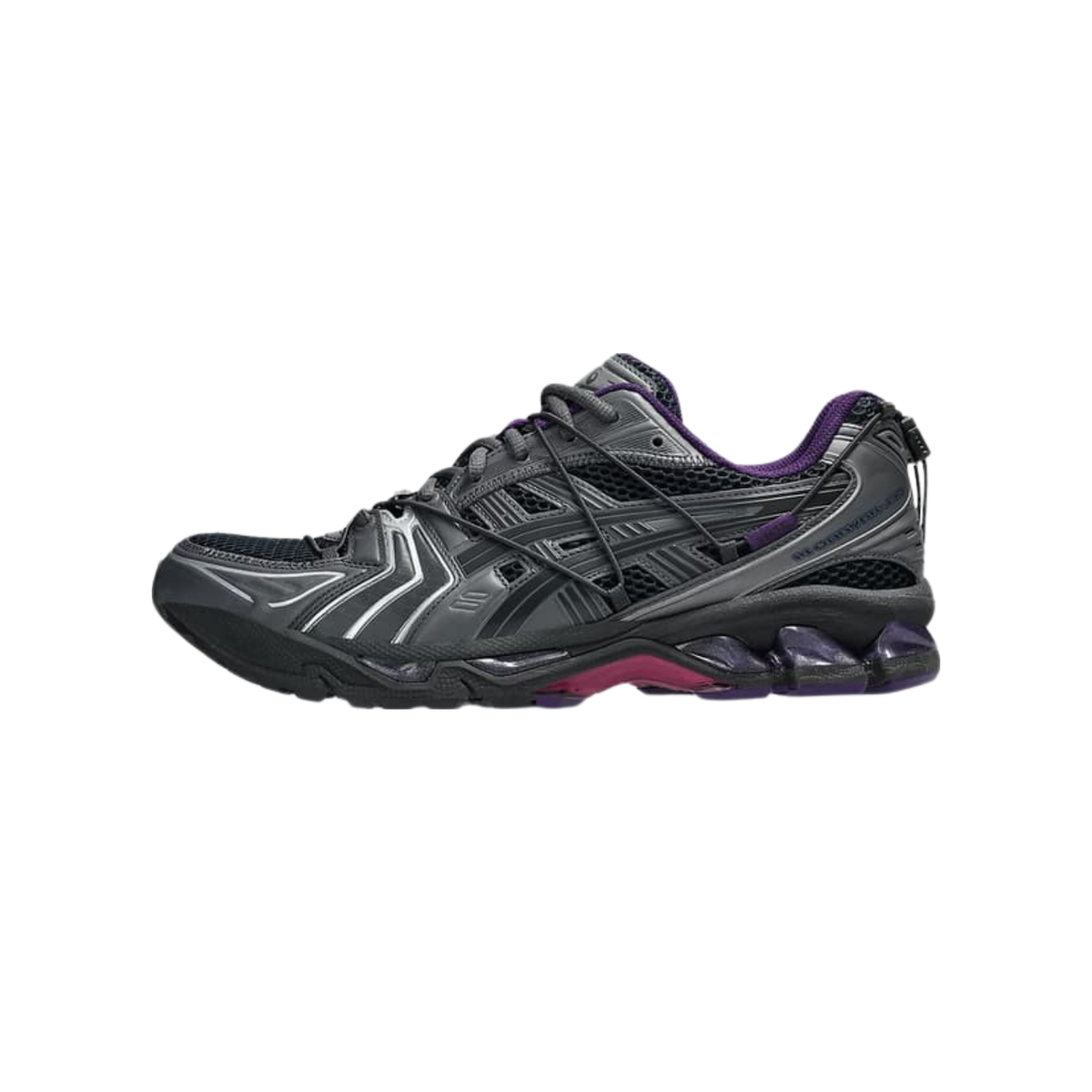 Side profile of a single grey and black ASICS Gel-Kayano 14 running shoe with purple accents at the heel collar and midsole, toe pointing left, showing mesh panels and silver overlays.