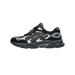 Side view of a black and grey ASICS Gel-NYC 2.0 sneaker with toe pointing left, showing mesh panels, layered overlays, and the GEL logo near the heel.