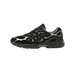 Side view of a black Asics Gel-NYC sneaker with silver overlays, purple heel and tongue accents, and a chunky textured midsole.
