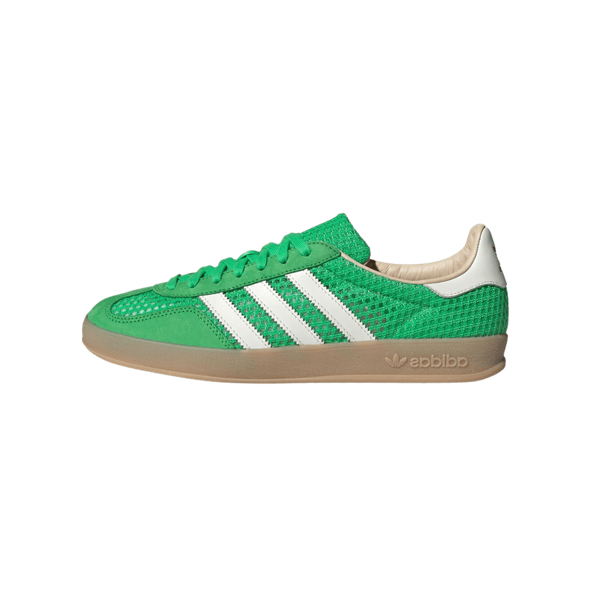 Side view of a green Adidas Gazelle Indoor sneaker with white stripes, mesh textured upper, gum sole, and cream heel tab, toe pointing left.