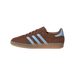 Right side view of a brown suede Adidas Gazelle Indoor sneaker with light blue stripes and heel tab, woven textured panel, and gum sole, toe pointing left