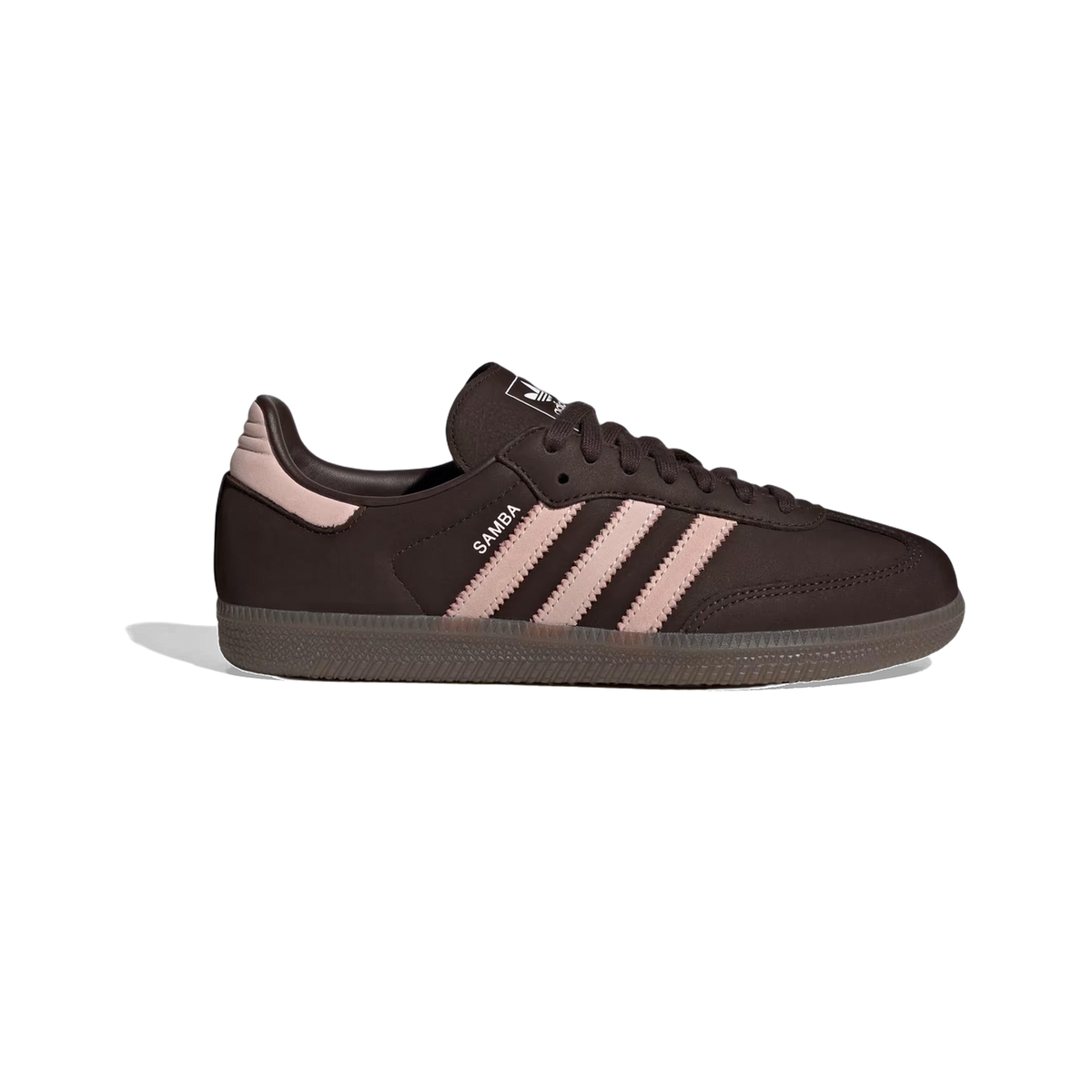 Side view of a brown Adidas Samba OG sneaker with pink suede stripes, pink heel tab, white Samba text on the quarter panel, and a gum outsole.