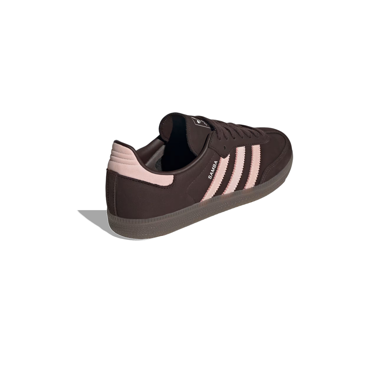 Rear angled view of a brown Adidas Samba OG sneaker with pink three stripes, heel tab, and gum outsole
