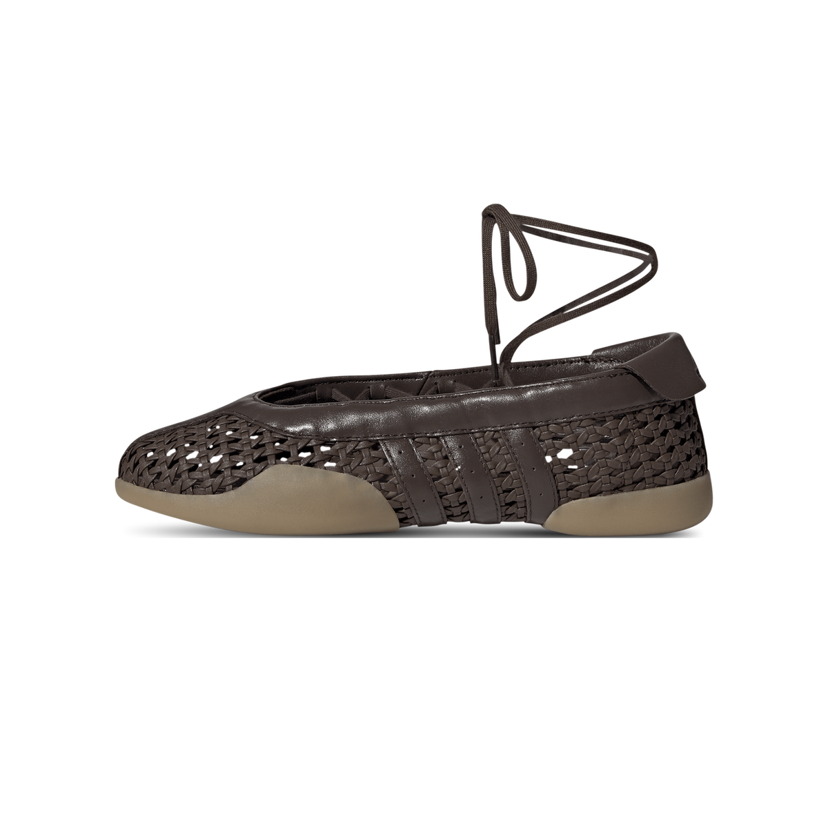 Side view of a brown Adidas Taekwondo Mei ballet flat with woven basketweave upper, three stripes, ankle tie lace, and a gum sole, toe pointing left.