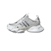 Side view of a grey, silver and white Adidas XLG Runner Deluxe sneaker with toe pointing left, showing chunky layered sole and mesh upper with silver stripes