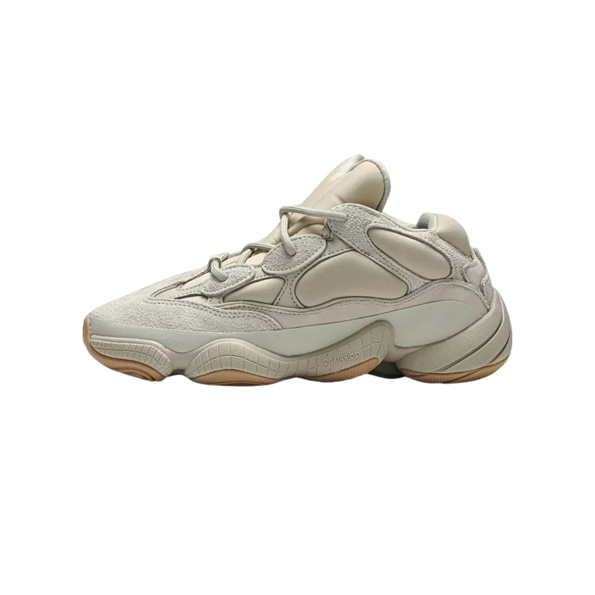 Side view of a beige Adidas Yeezy 500 Stone sneaker with chunky sole and gum-colored outsole, toe pointing left.