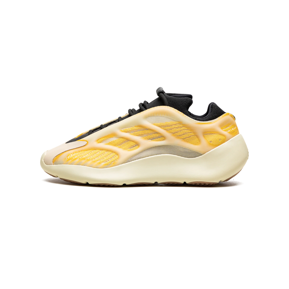 Side view of a single Yeezy 700 V3 sneaker with a yellow webbed lattice upper over a cream midsole and black collar.