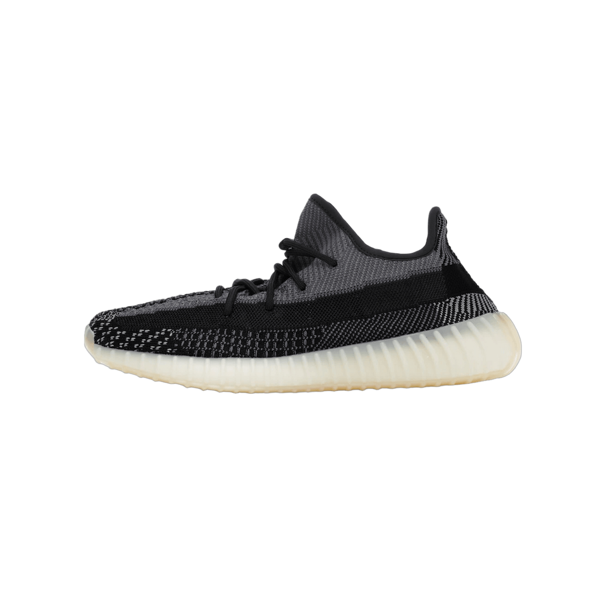 Left shoe of an Adidas Yeezy Boost 350 V2 Carbon sneaker shown from the outside in gray and black knit with a translucent midsole, toe pointing left.