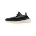 Left shoe of an Adidas Yeezy Boost 350 V2 Carbon sneaker shown from the outside in gray and black knit with a translucent midsole, toe pointing left.