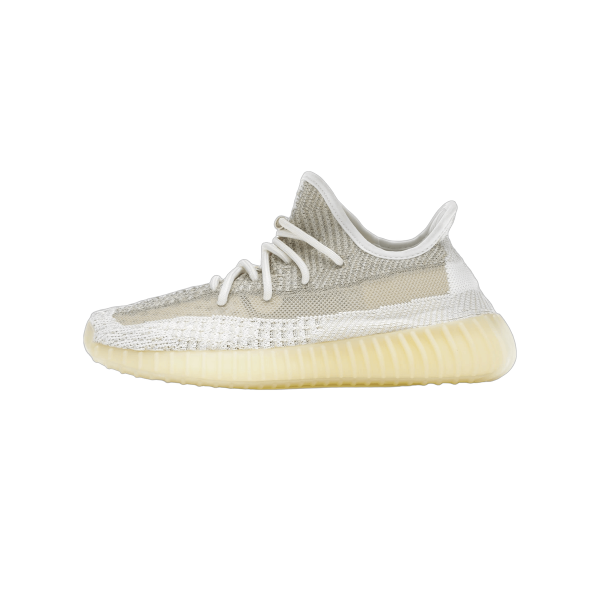 Side view of a beige and white Adidas Yeezy Boost 350 V2 knit sneaker with translucent sole, toe pointing left.