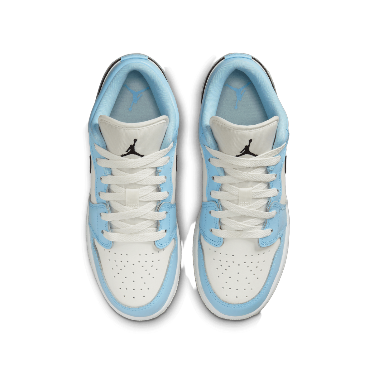 Top-down view of a pair of Jordan 1 Low sneakers in white and ice blue with white laces and Jumpman logos on the tongues