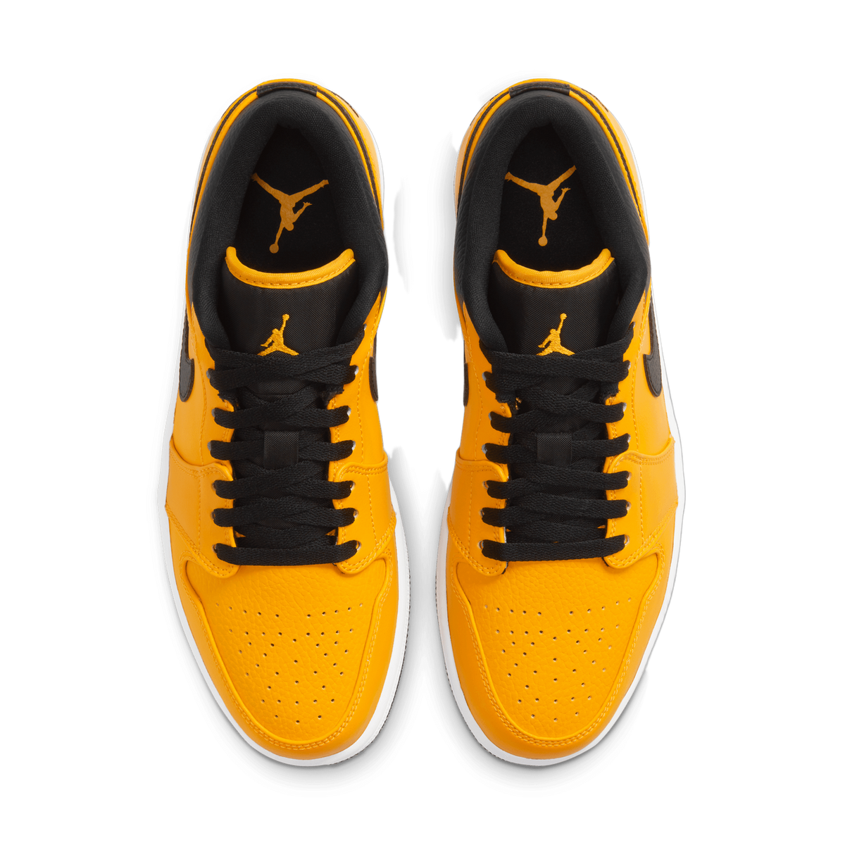 Top-down view of a pair of yellow and black low-top sneakers with white midsoles, laces undone to show the tongues and collars, with a gold Jordan Jumpman logo on each tongue.