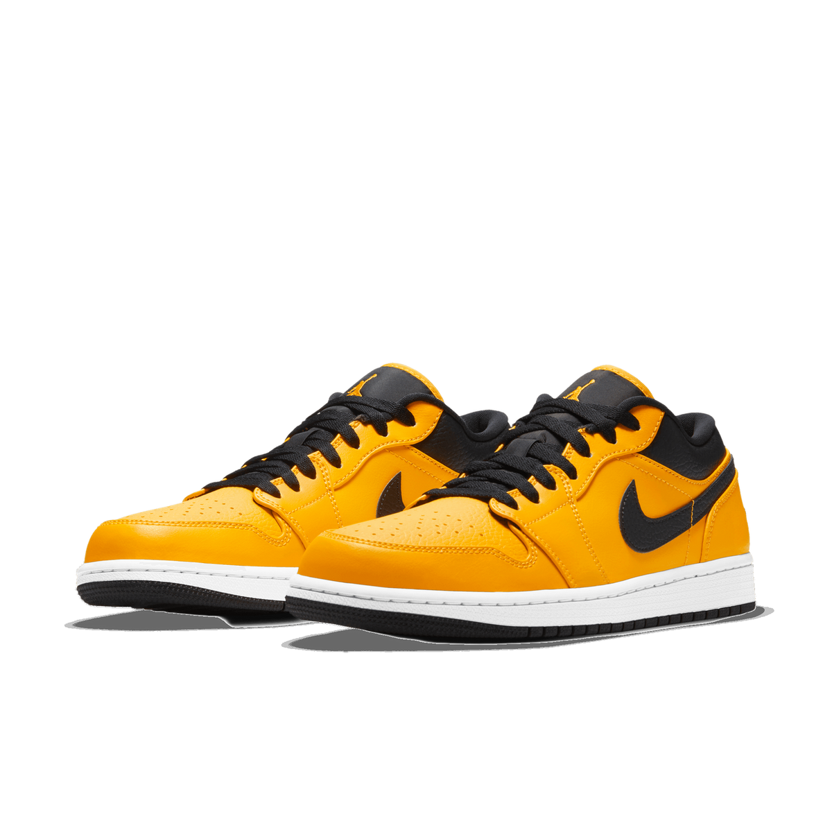 A pair of gold and black low-top sneakers with white midsoles and black outsoles, shown side by side at a three-quarter angle, with the Nike swoosh logo visible on the black side panels.