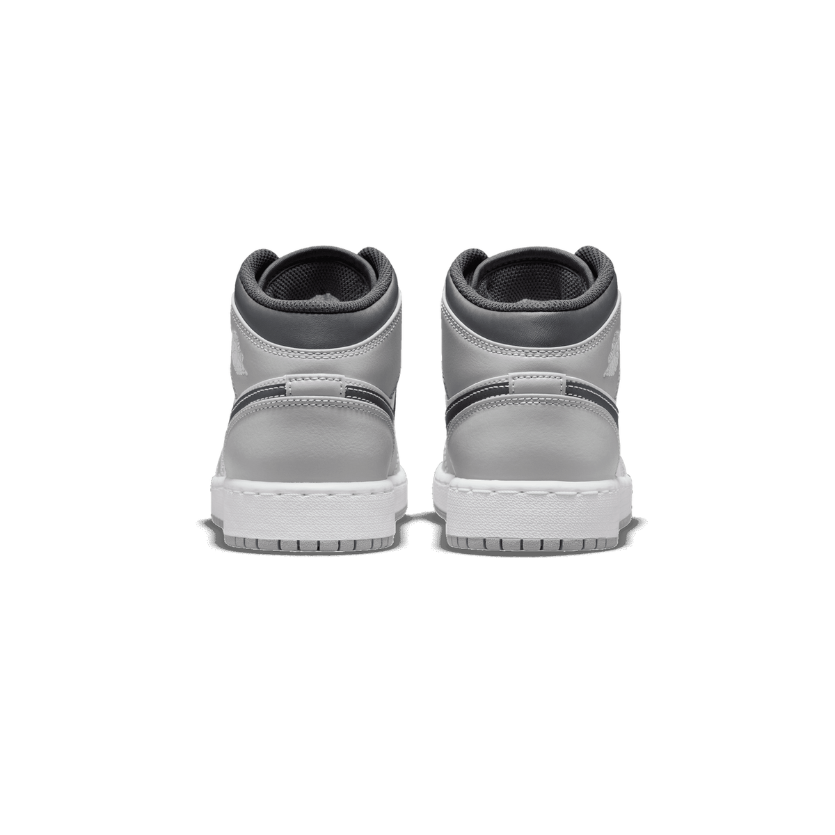 Rear view of a pair of gray Air Jordan 1 Mid sneakers with white soles and dark gray ankle collars