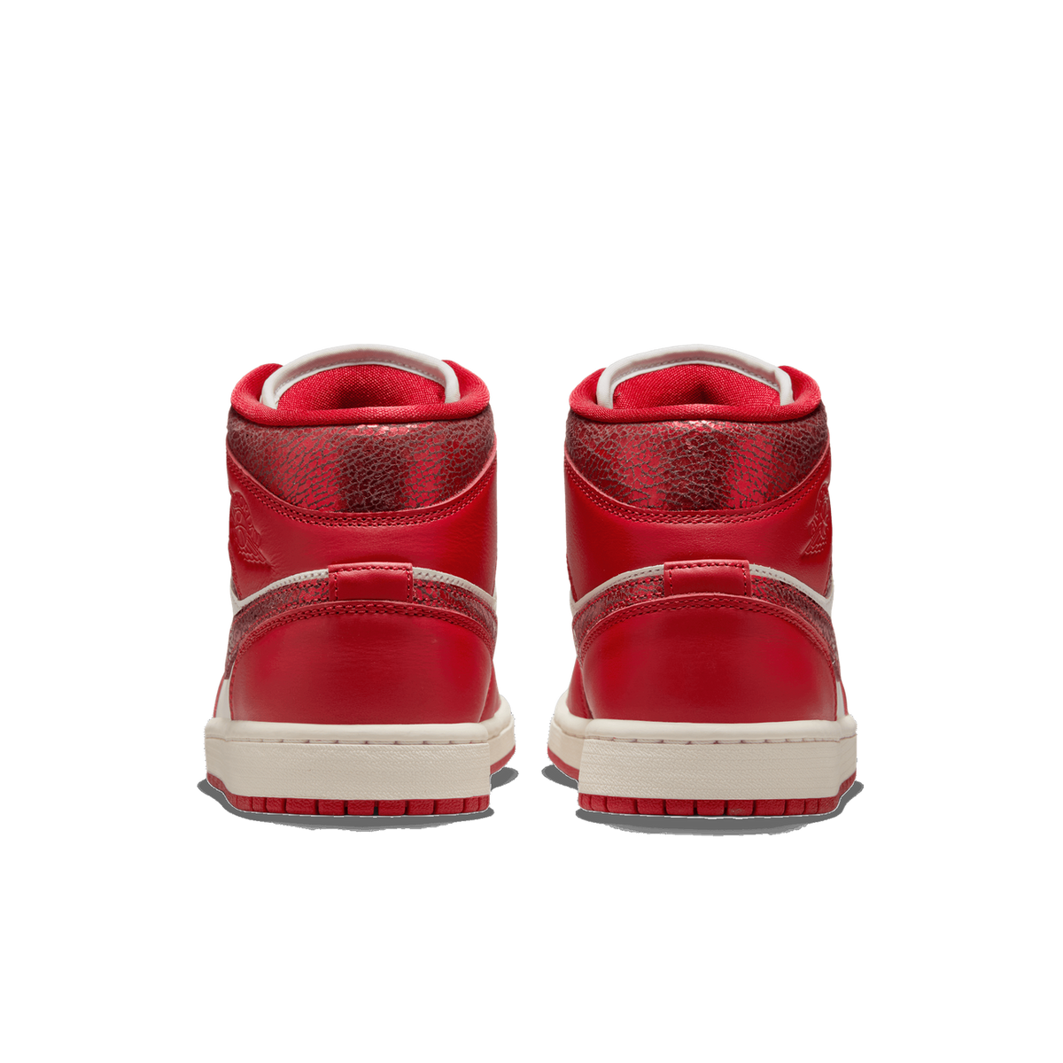 Rear view of a pair of red Air Jordan 1 Mid sneakers with cracked-texture heel panels and cream midsoles