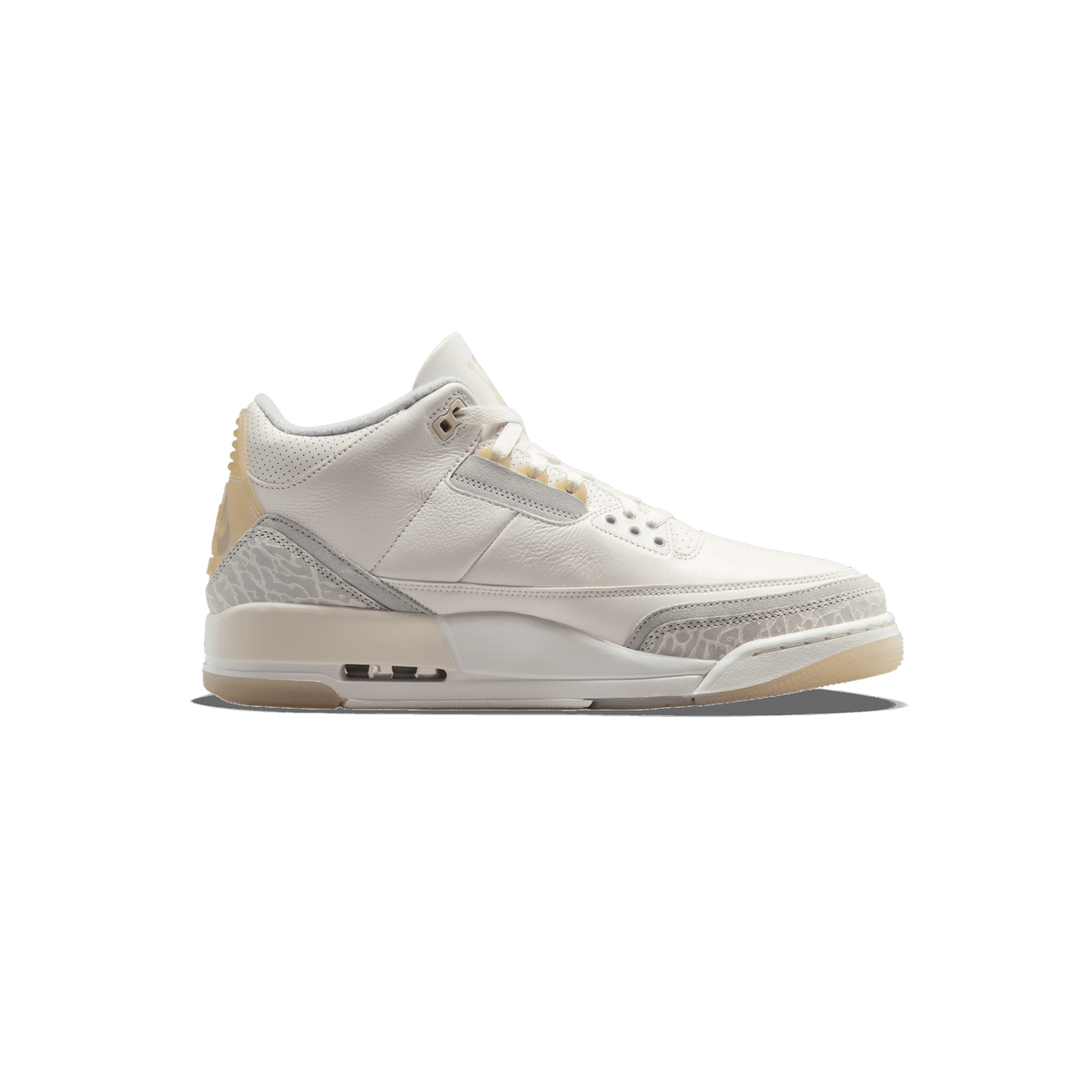 Side view of a white Air Jordan 3 Retro Craft Ivory sneaker with grey elephant print detailing and tan heel accent, toe pointing left.