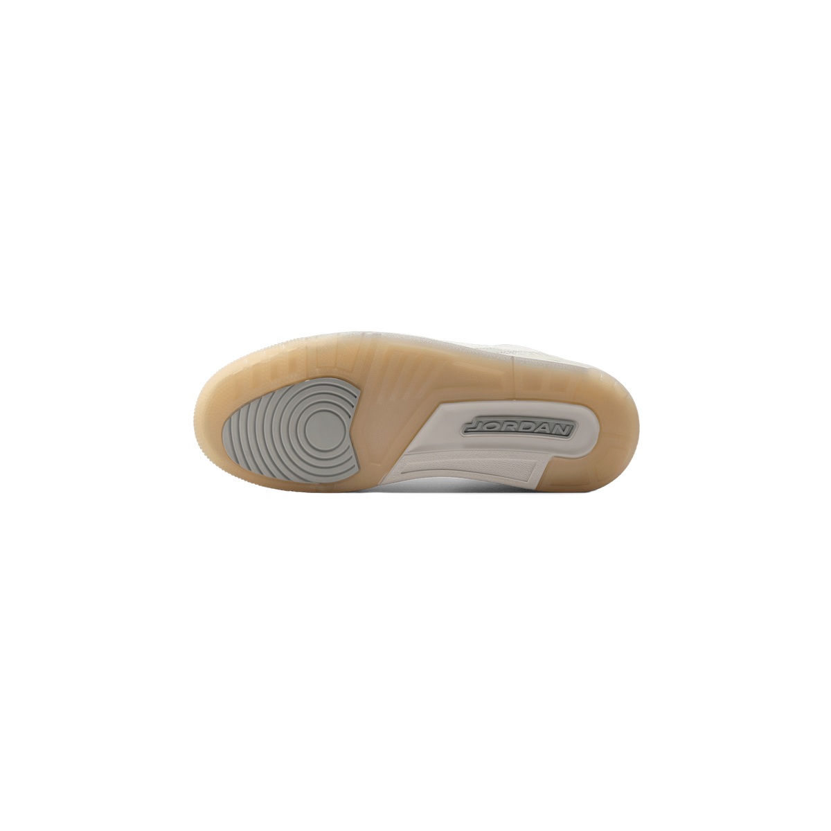 Bottom view of a single sneaker showing a translucent gum rubber outsole with grey heel and forefoot inserts and a Jordan logo near the heel