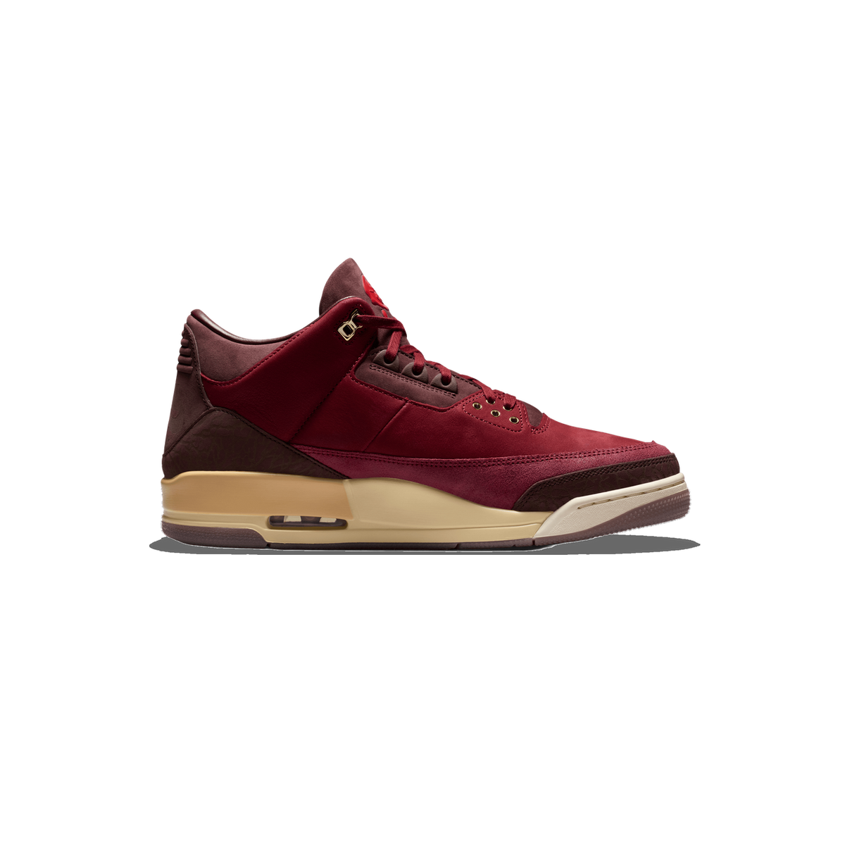 Side profile of a red and dark burgundy Air Jordan 3 sneaker with the toe pointing left, showing gold eyelets, a gold lace lock, and a tan and cream midsole with a visible Air unit.