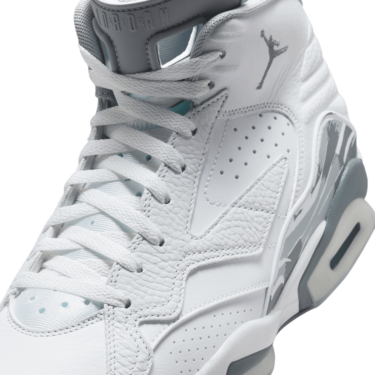 Close-up angled view of a white Air Jordan MVP sneaker showing the laces, perforated toe panel, Jumpman logo on the tongue, and cool grey midsole and outsole details.