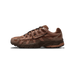 Side profile of a brown Nike P-6000 sneaker with a toe pointing left, showing mesh and suede panels, a glossy Swoosh logo on the side, black laces, and a textured brown rubber sole.