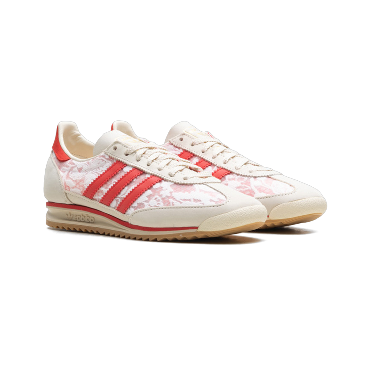 Pair of cream Adidas SL 72 sneakers with red floral print panels, red three-stripe branding, and gum soles shown at an angle.