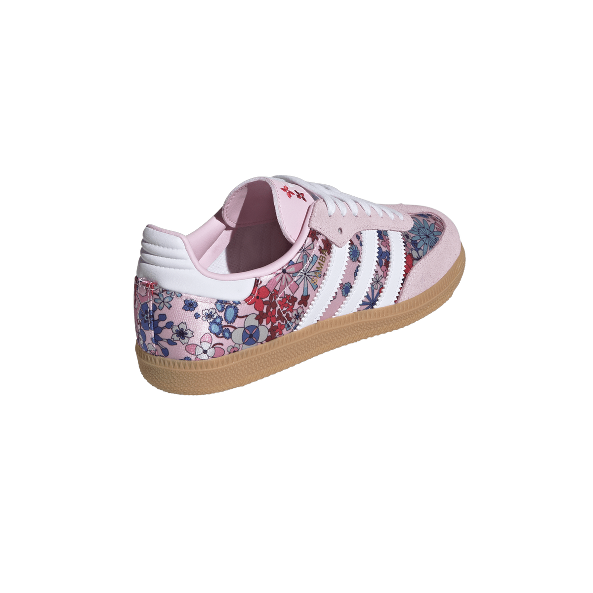 Rear-side view of a pink Adidas Samba sneaker featuring a multicolor floral print, white stripes and heel tab, and a gum rubber sole.