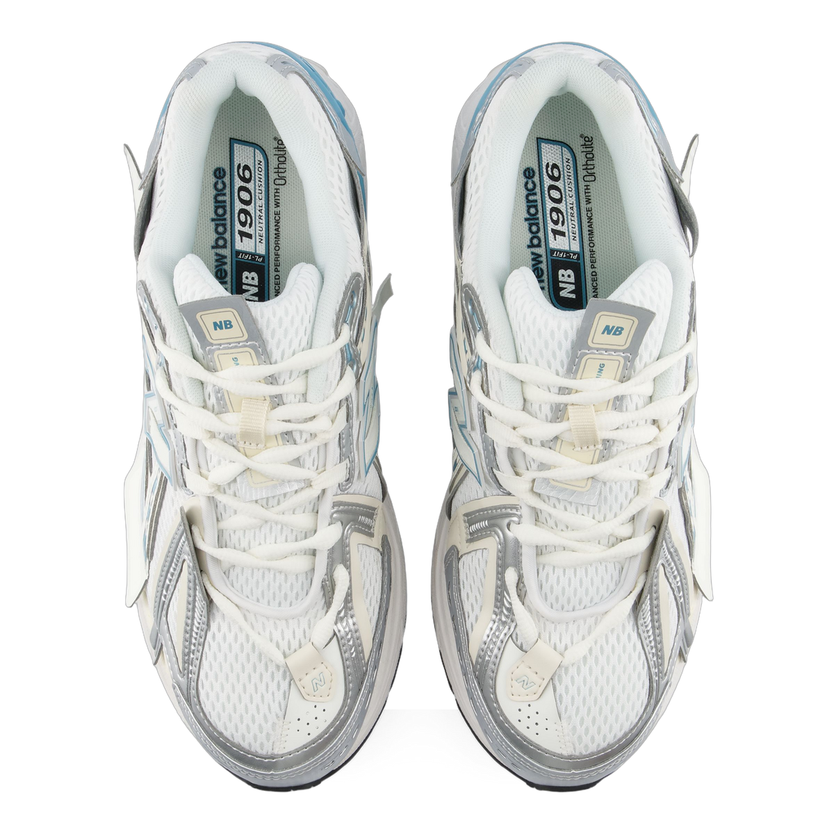 Top-down view of a pair of white and silver New Balance 1906A sneakers with light blue accents and visible branded insoles reading 1906 and NB