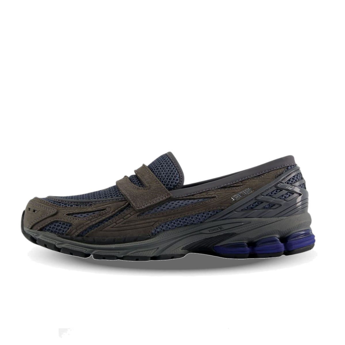 Side view of a gray loafer-style sneaker hybrid with navy mesh panels, a slip-on vamp strap, and a chunky gray sole with purple accents at the heel