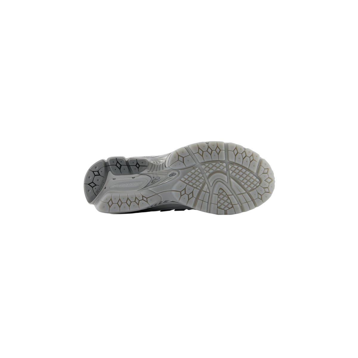 Bottom view of a gray New Balance 1906R sneaker showing the textured outsole tread pattern and New Balance logo on the heel
