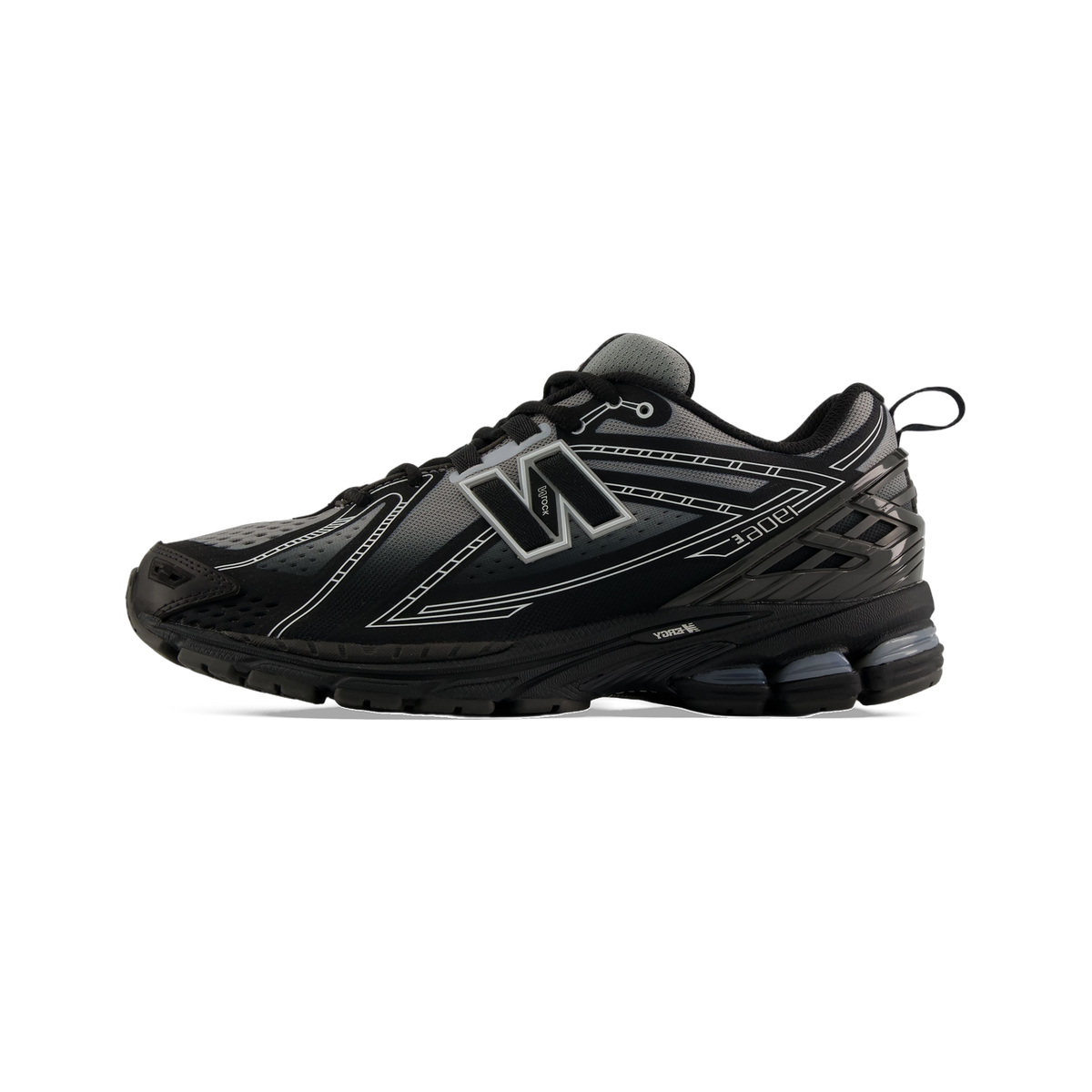 Lateral view of a black New Balance 1906E sneaker with grey and white accents and a visible ABZORB heel unit.