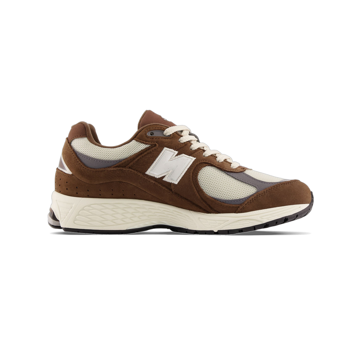 Side view of a brown and cream New Balance 2002R sneaker with toe pointing left, featuring a white N logo and cream laces and sole.