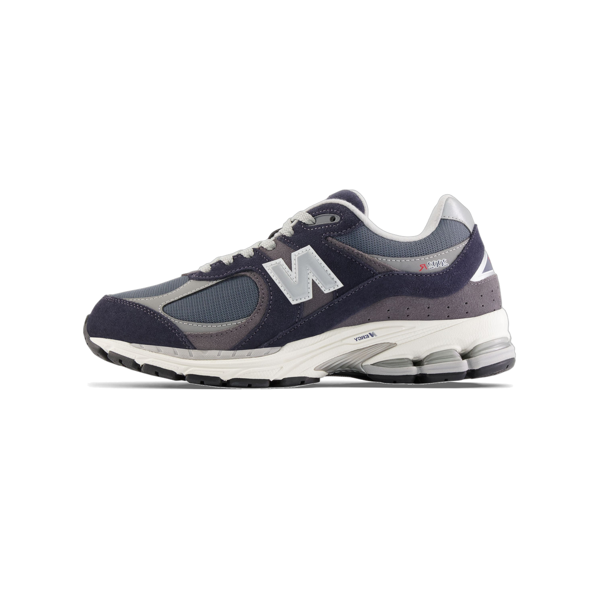 Side view of a navy and gray New Balance 2002R sneaker with a silver N logo and white midsole, toe pointing left.
