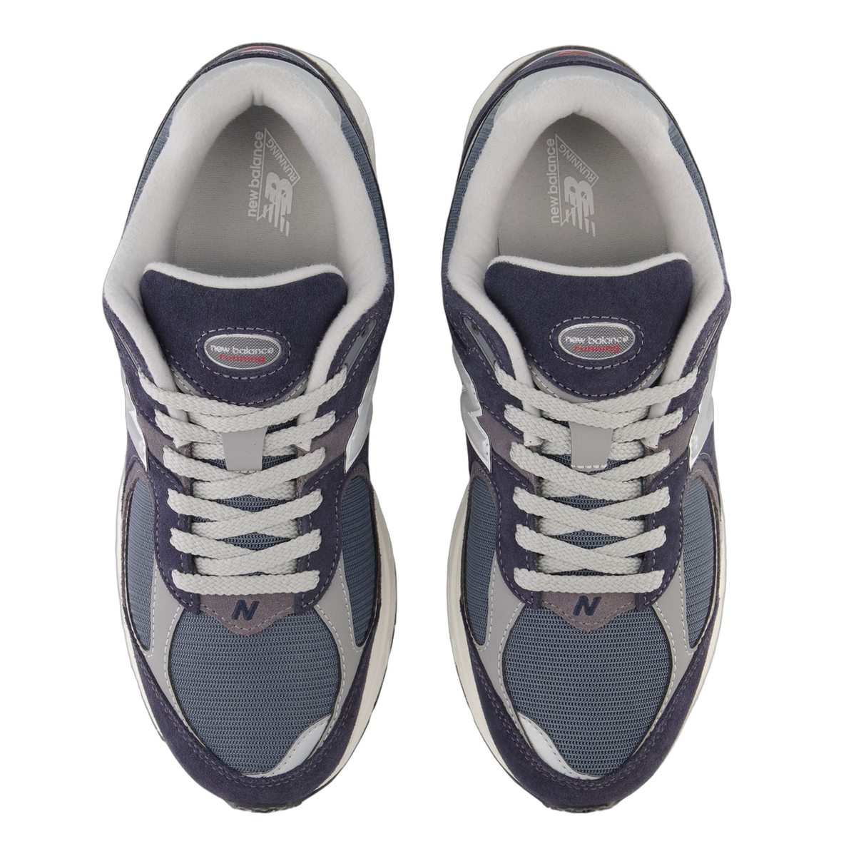 Top-down view of a pair of New Balance 2002R sneakers in navy, grey and blue with white laces and grey N logo on the tongue