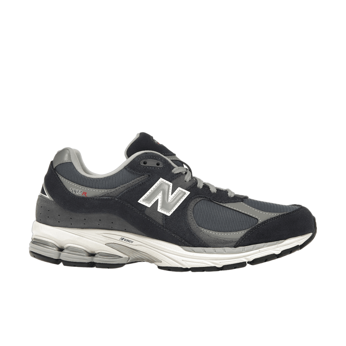 Left New Balance 2002R sneaker in dark gray and black suede with white N logo, gray laces, and white midsole, shown from the side with toe pointing left